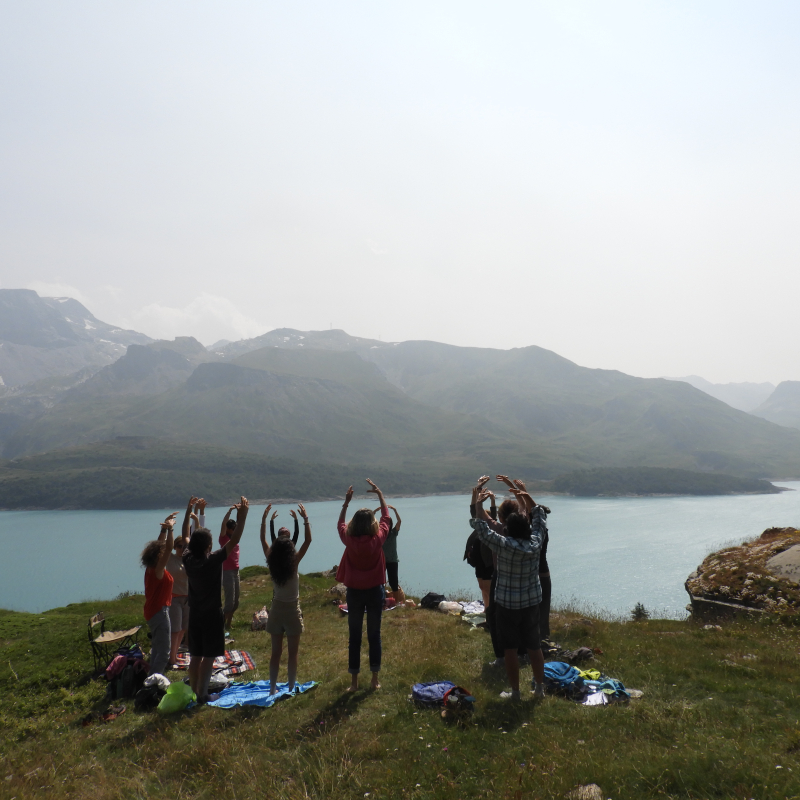 Group of Qi Qong practitioners above Lac du Mont Cenis